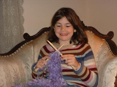 Knit Heaven Kids' Corner Child knitting - This photo is the property of KnitHeaven.com © 2004-2010 and may not be used without permission